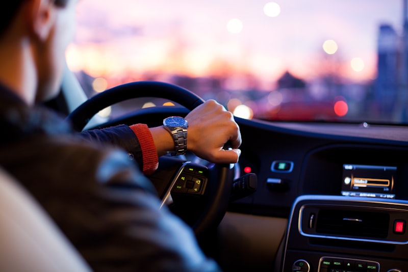 A car dashboard with the instrument cluster lit up.